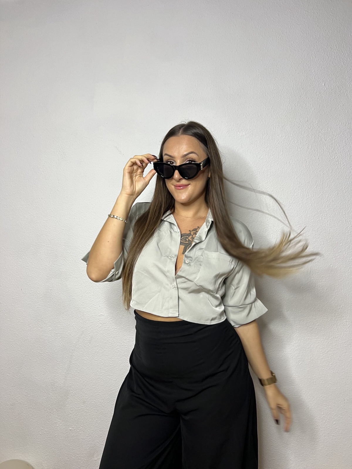 Elsi in sunglasses, laughing