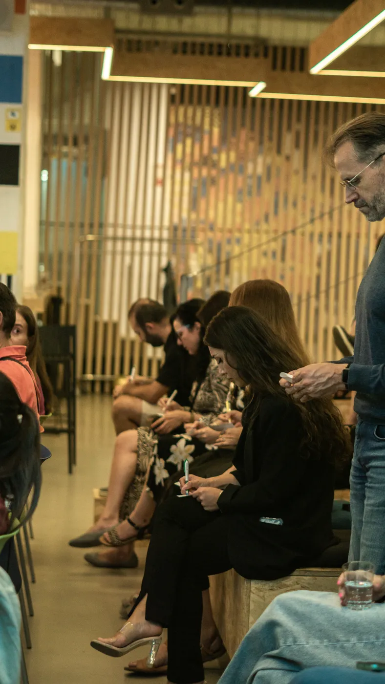 Guests writing during a networking game