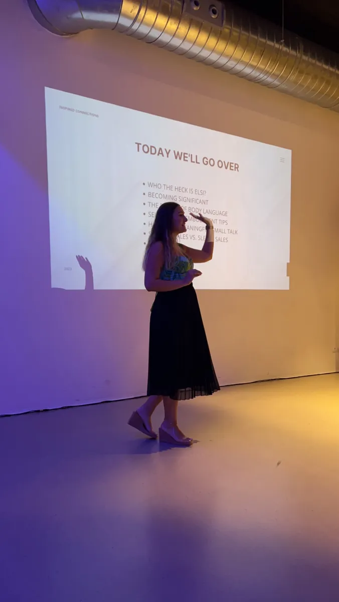 Elsi speaking on stage